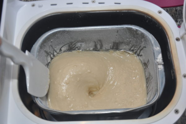 Eggless vanilla cake mixing in bread machine.