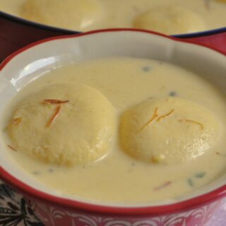 I2 pieces of Rasmalai served in a bowl.