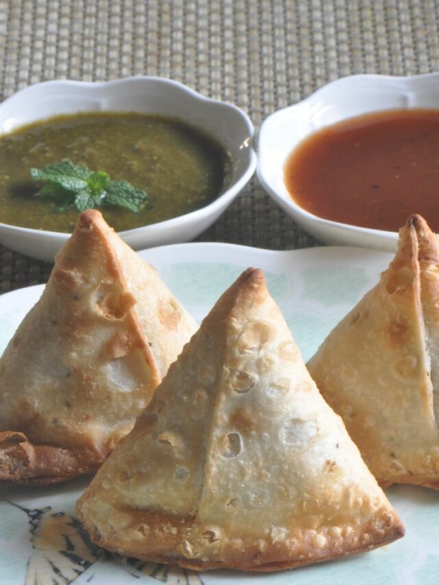 Frozen samosa served with chutney and sauce.