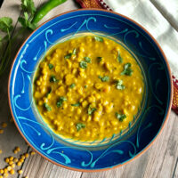 chana dal in a bowl garnished with cilantro