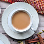 masala chai served in a cup and saucer.