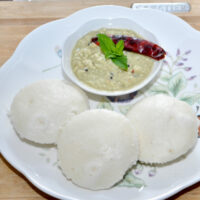 idli in a plate with chutney