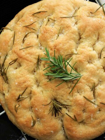 Focaccia bread with rosemary on top for garnishing.