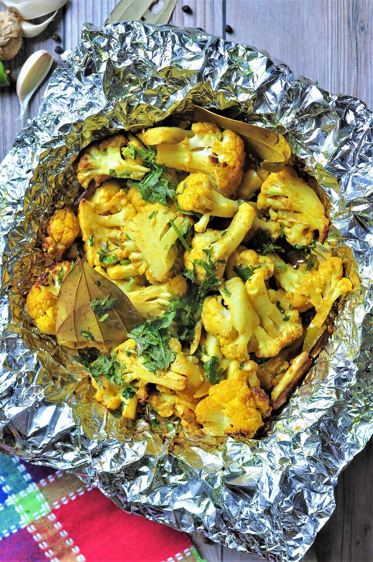 Cauliflower florets placed in a tin foil and cooked in Air Fryer.