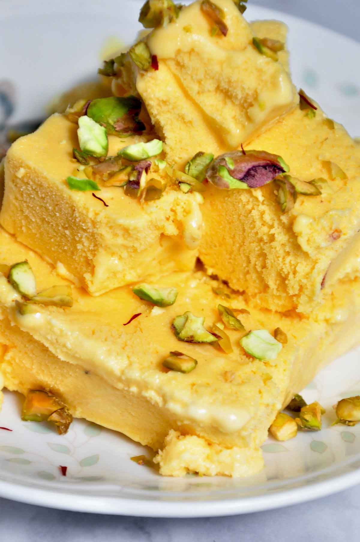 Cubes of mango kulfi in a plate.