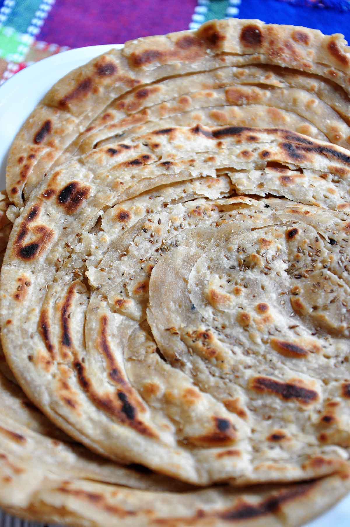 Close-up of Layered flaky flat bread in a plate.