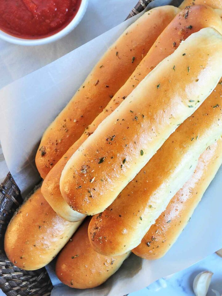 baked bread sticks stacked on each other.