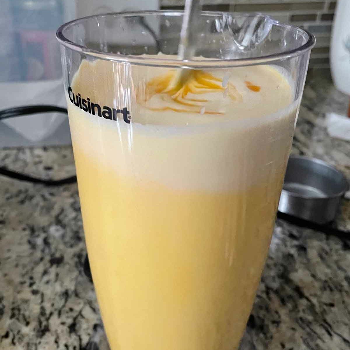 Mango pulp and heavy cream mix for mango ice cream.