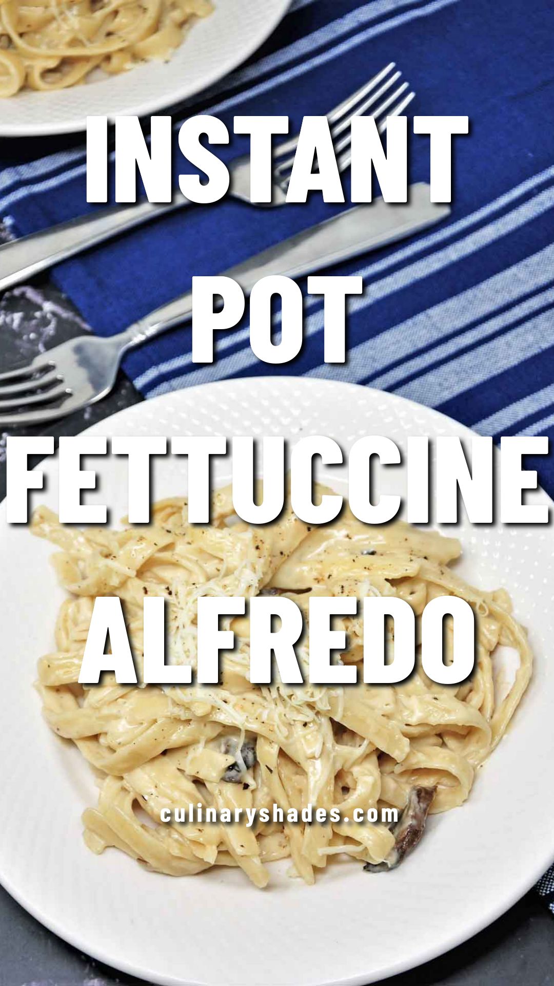 Fettuccine Alfredo served in a plate with shredded cheese topping.