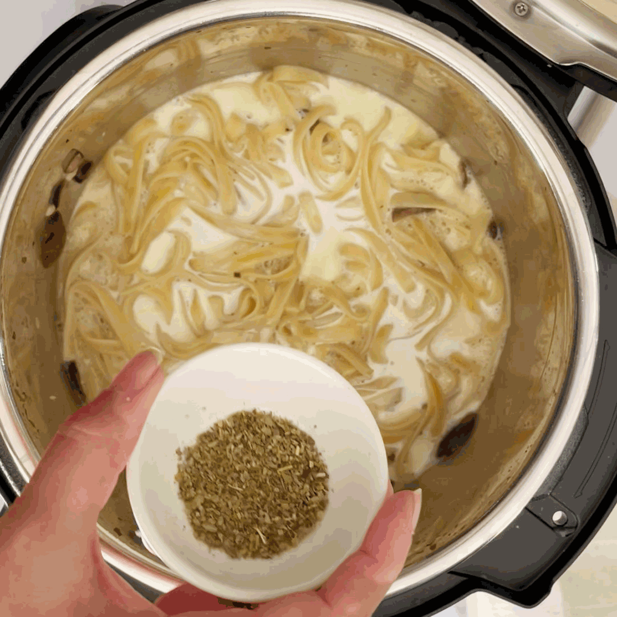 Add Italian seasoning to pasta.