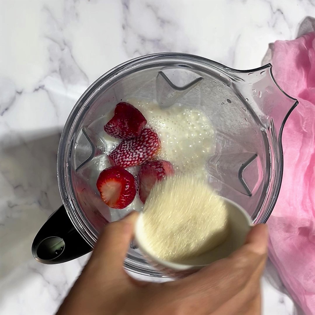 Add all strawberry milkshake ingredients to blender.
