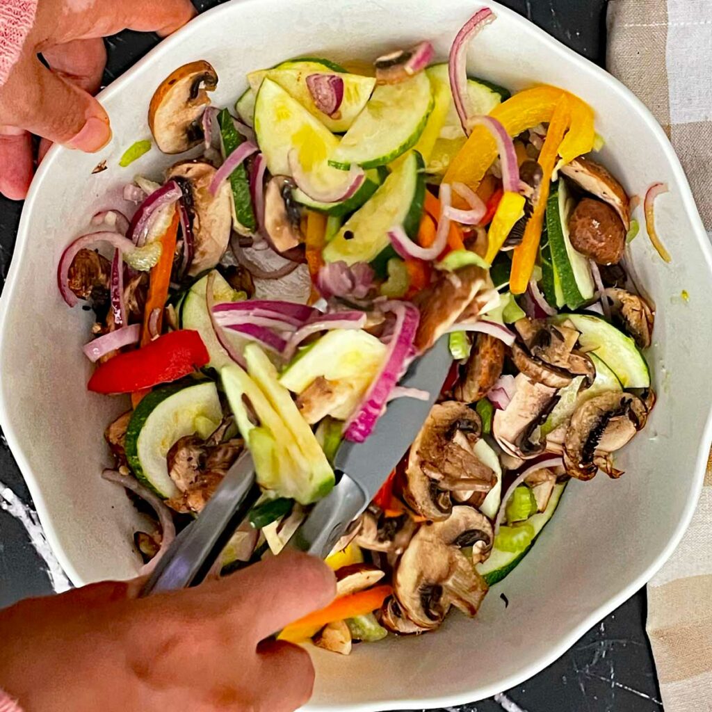 Mixing Veggies in a bowl for wrap.
