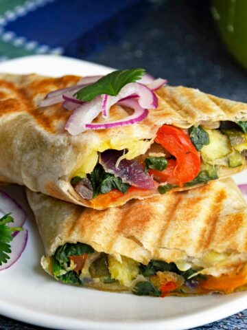 Grilled vegetable wrap served in a plate.