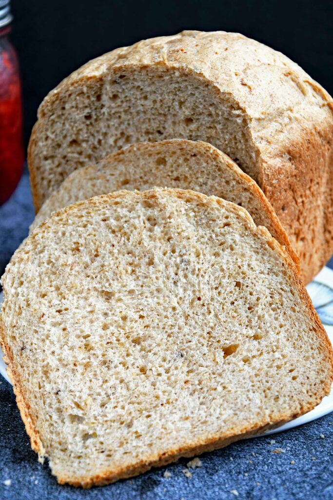 Multi-grain bread slices on a cheese board.