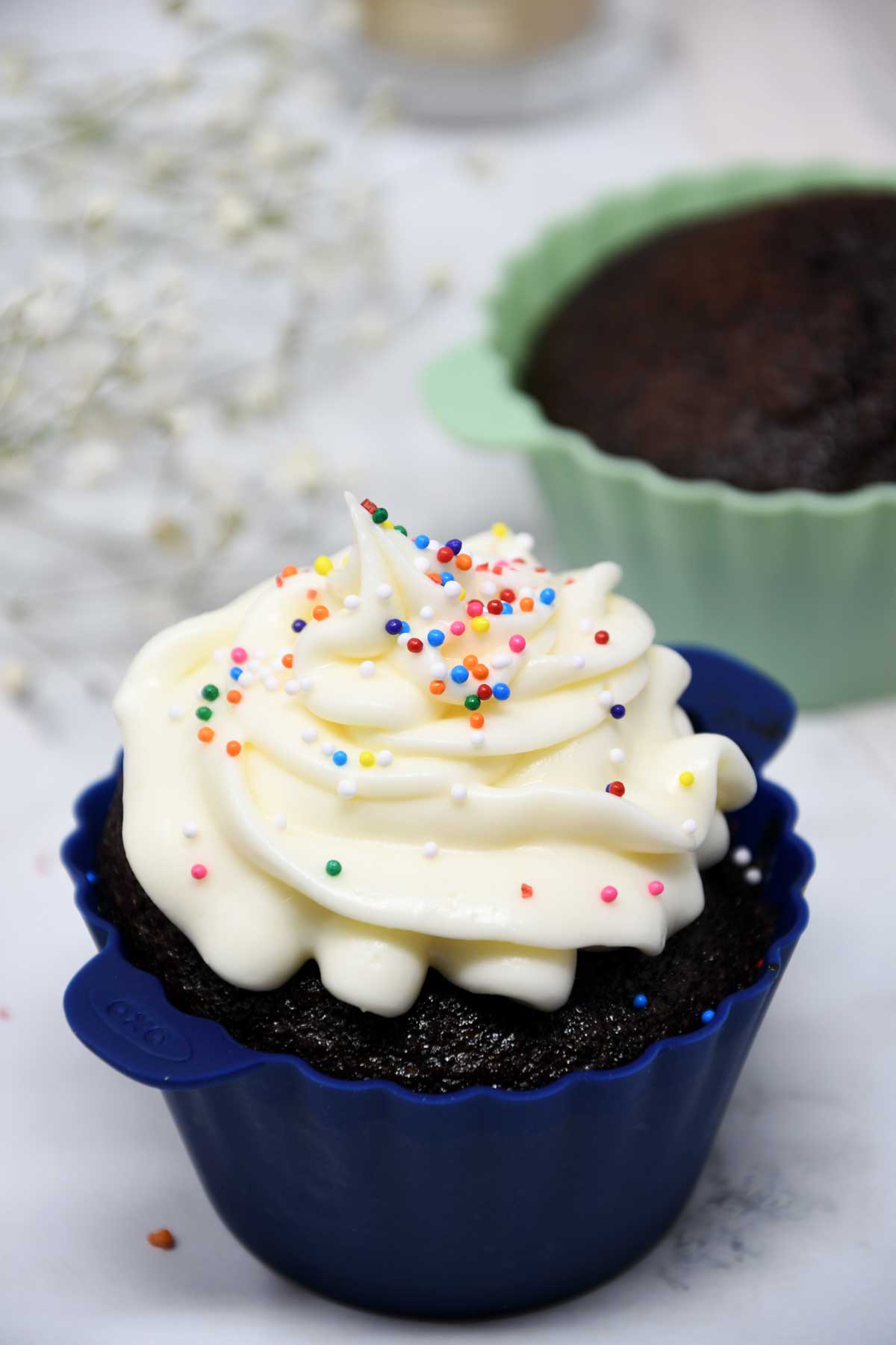 Air fryer cup cakes with frosting.