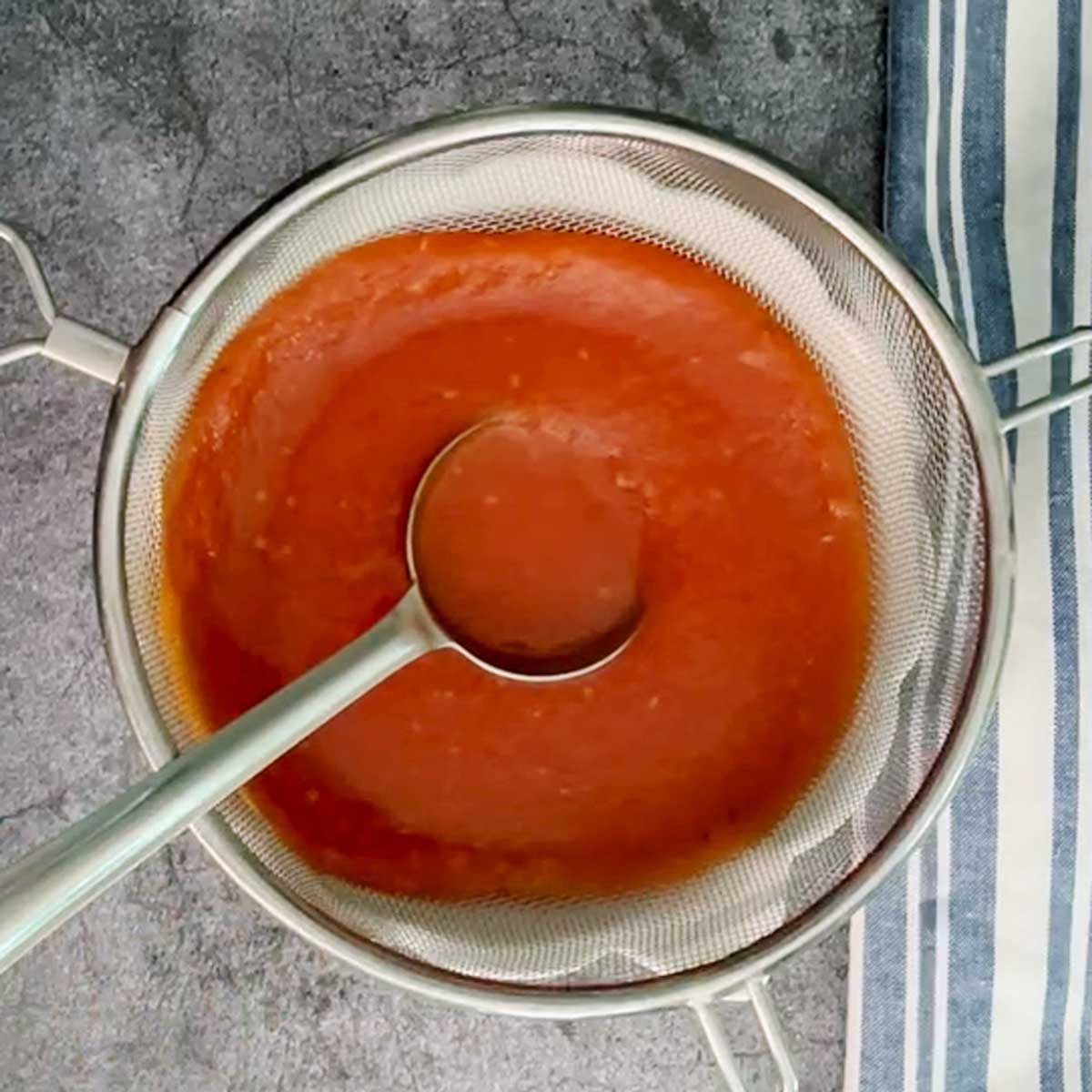 Straining Tomato ketchup blended ingredients.