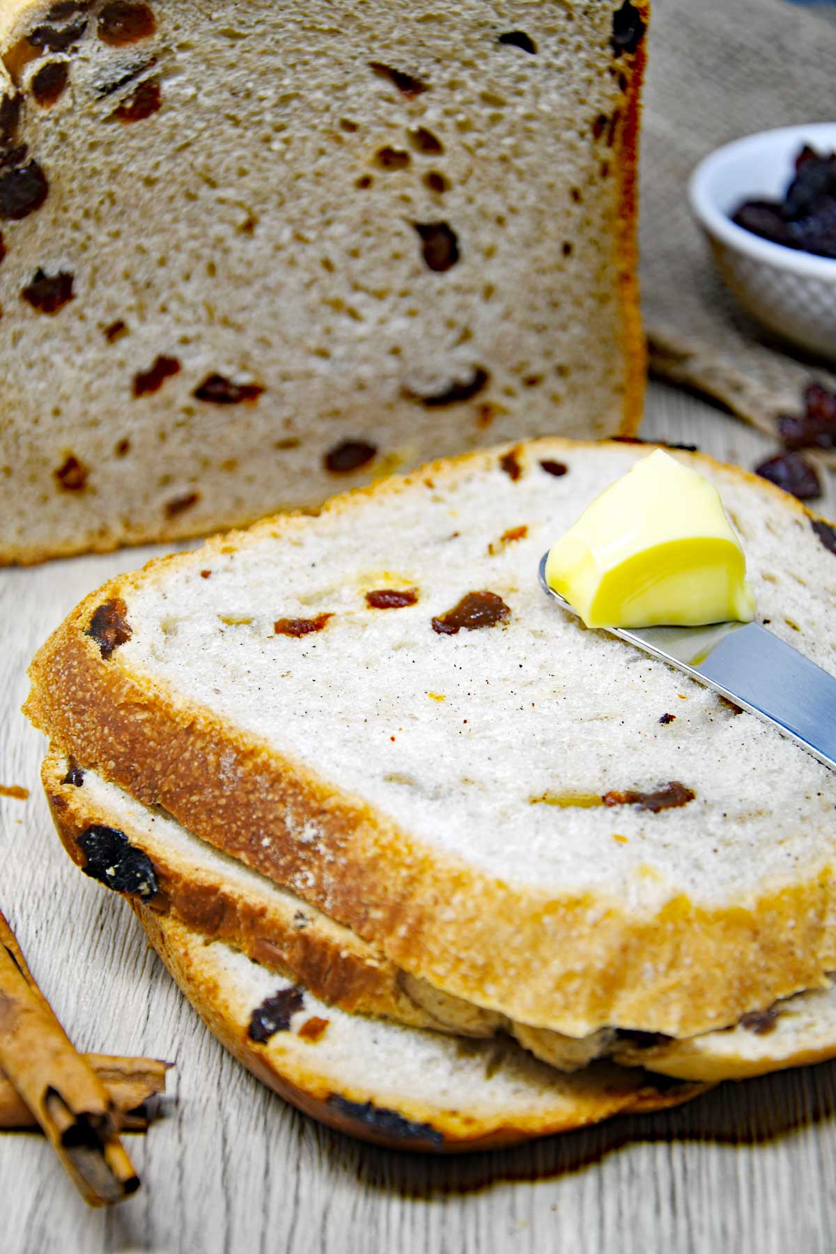 Cinnamon raisin bread loaf and slices.