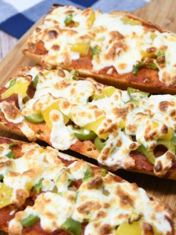 French bread pizza on a platter.