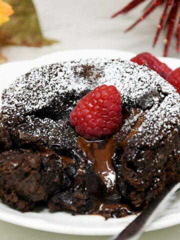Lava cake with raspberry topping.