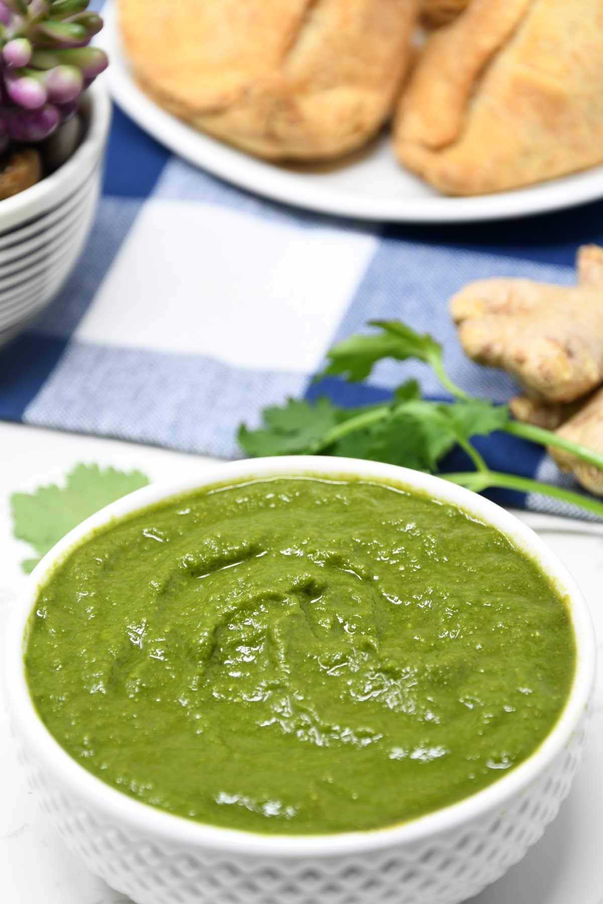 Green chutney served in a bowl.