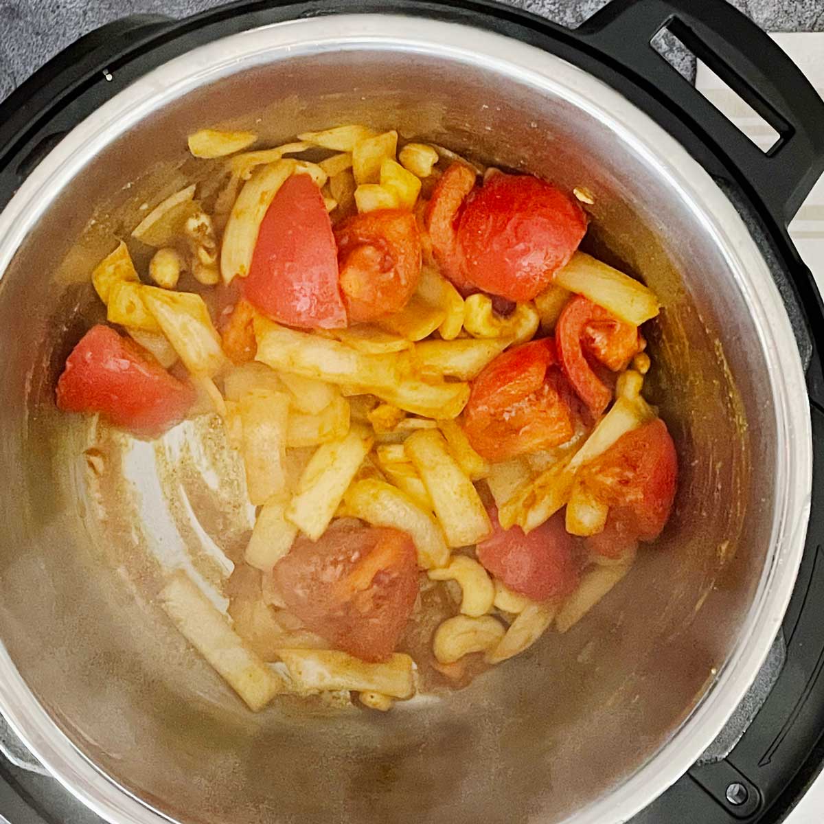 Saute onion and tomato for methi malai matar.