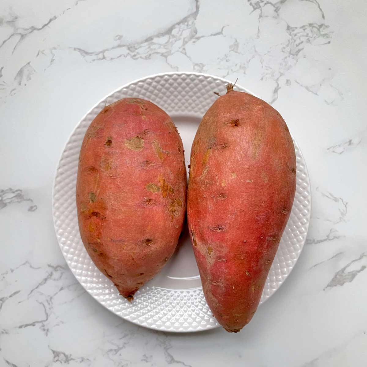 Raw whole sweet potato.