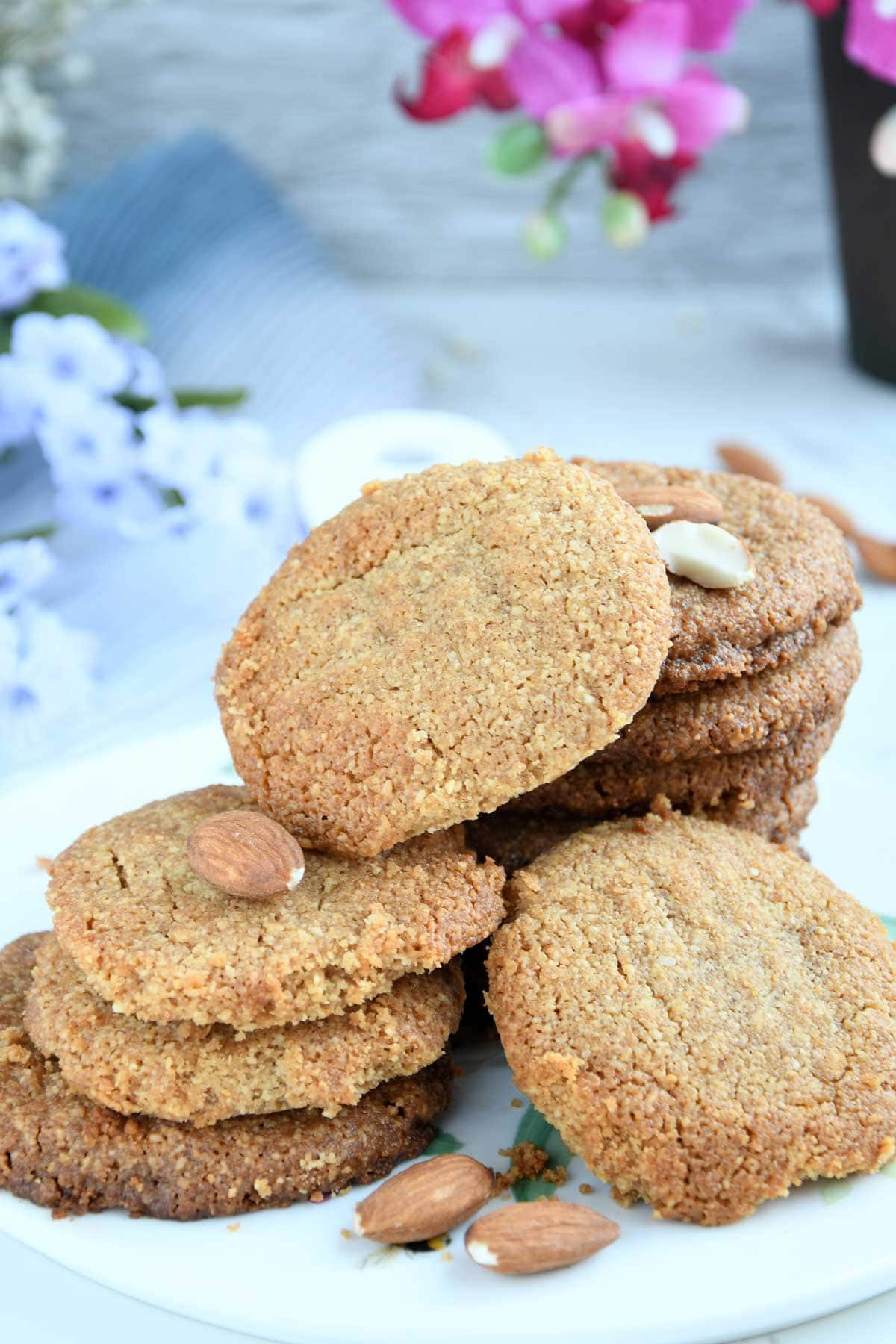 Almond flour peanut butter cookies stacked on a plate.