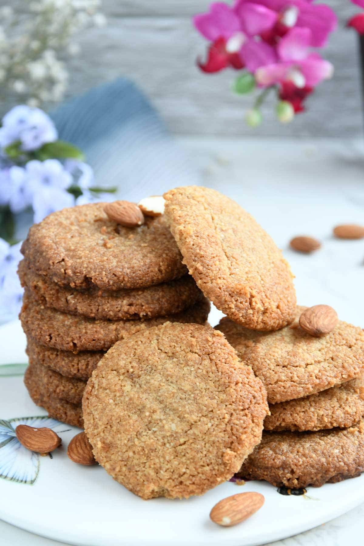 Almond flour peanut butter cookies stacked on a plate.