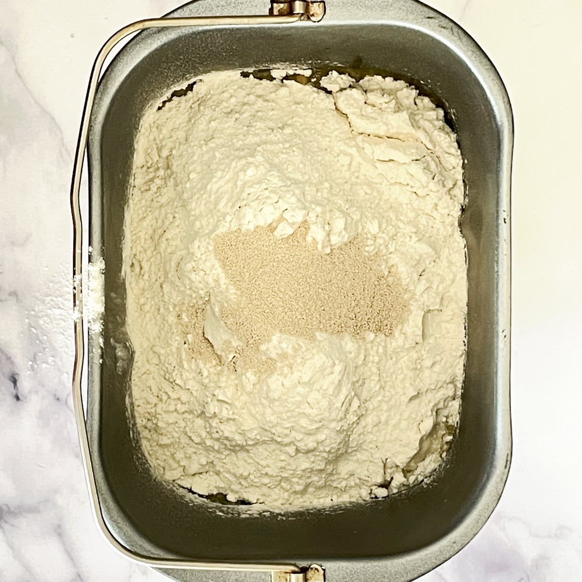 Milk bread ingredients in bread pan