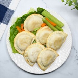 Air fryer baked pierogies served in a plate.