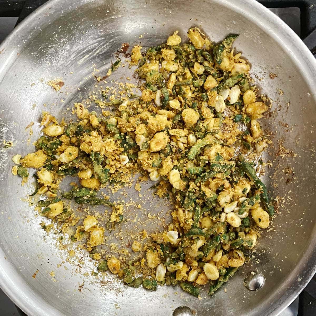 Stuffed karela filling cooked in a skillet.