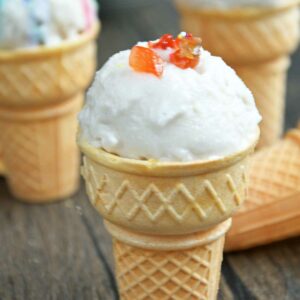 Vegan vanilla ice cream scoops served in cones.