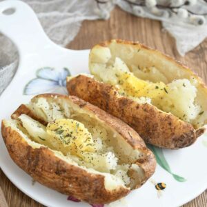 Air fryer baked potatoes served in a platter.