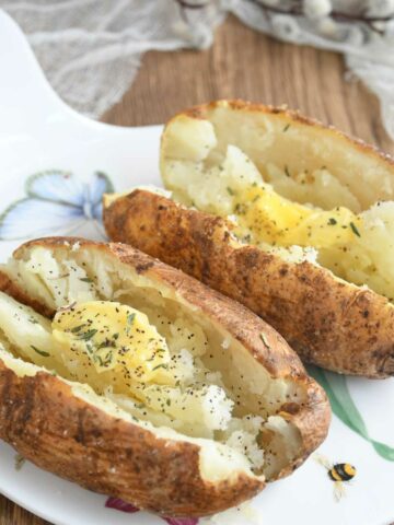 Air fryer baked potatoes served in a platter.
