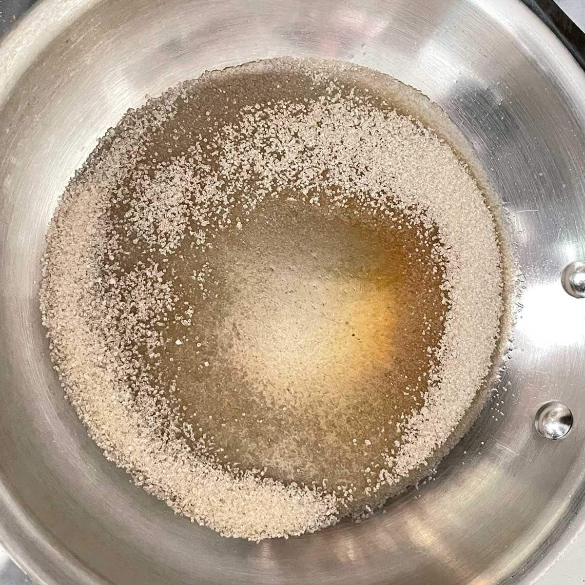 Butterscotch ice cream sugar in wok.