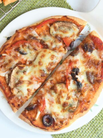Air fryer pizza slices on a platter.