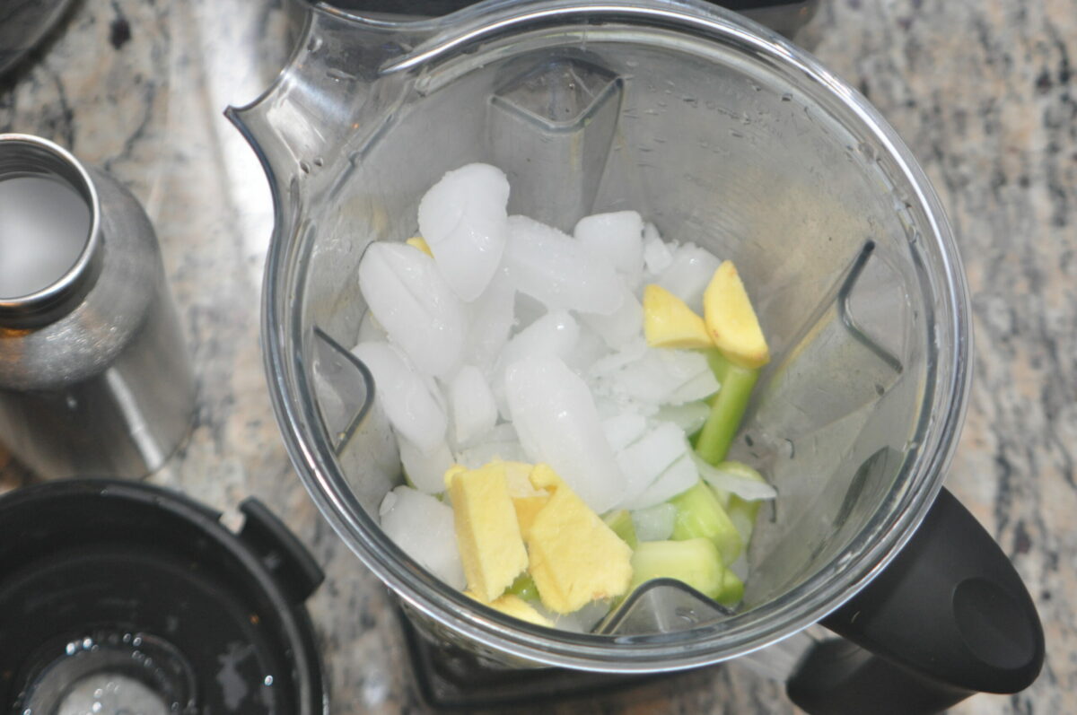 celery juice ingredients in Vitamix jar.