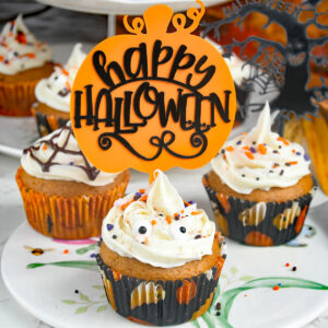 Pumpkin cup cakes with halloween decoration.