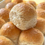 Multi grain dinner roll glazed with butter.