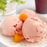 Strawberry and Passion fruit icecream scoops in dessert plate.