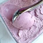 Delicious Mixed berry ice cream scoop in container.