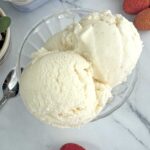 Lychee ice cream scoops in a serving bowl.